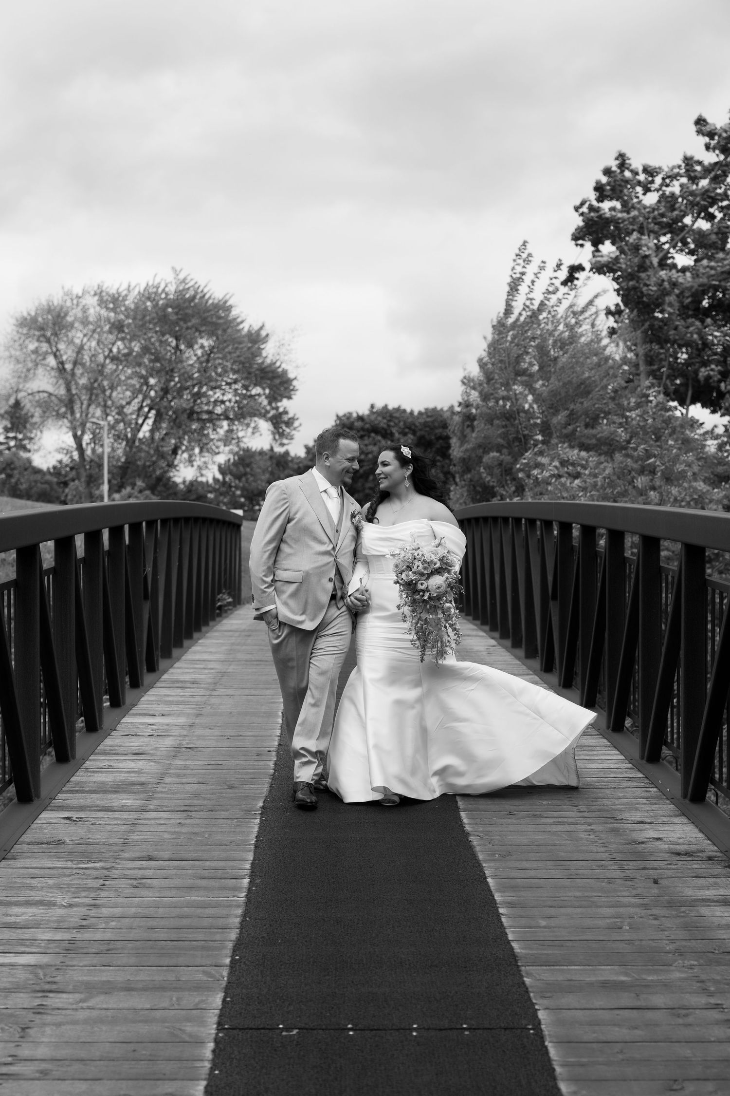 Bride and groom on bridge at Islington Golf Club wedding
