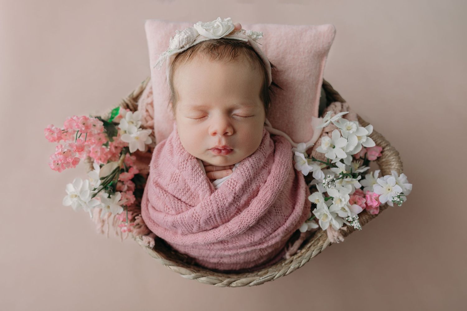 twin baby girl photos with floral setup in Tampa