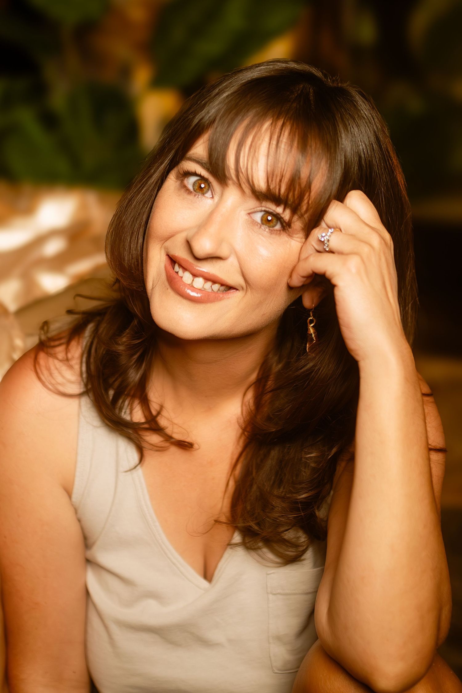 Close-up golden hour portrait with soft smile, captured by Fort Worth's leading boudoir photographer in an intimate, healing shoot.