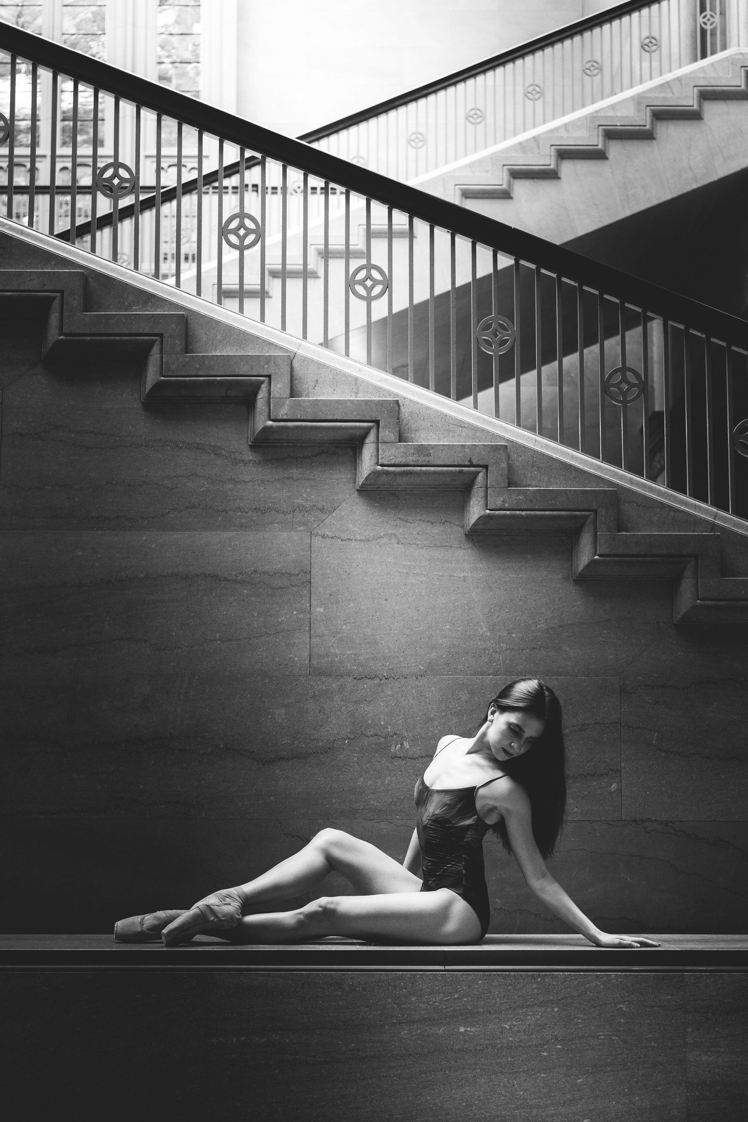 Ballet dancer from the Joffrey Ballet posing elegantly during a fine art photoshoot inside the Art Institute of Chicago.