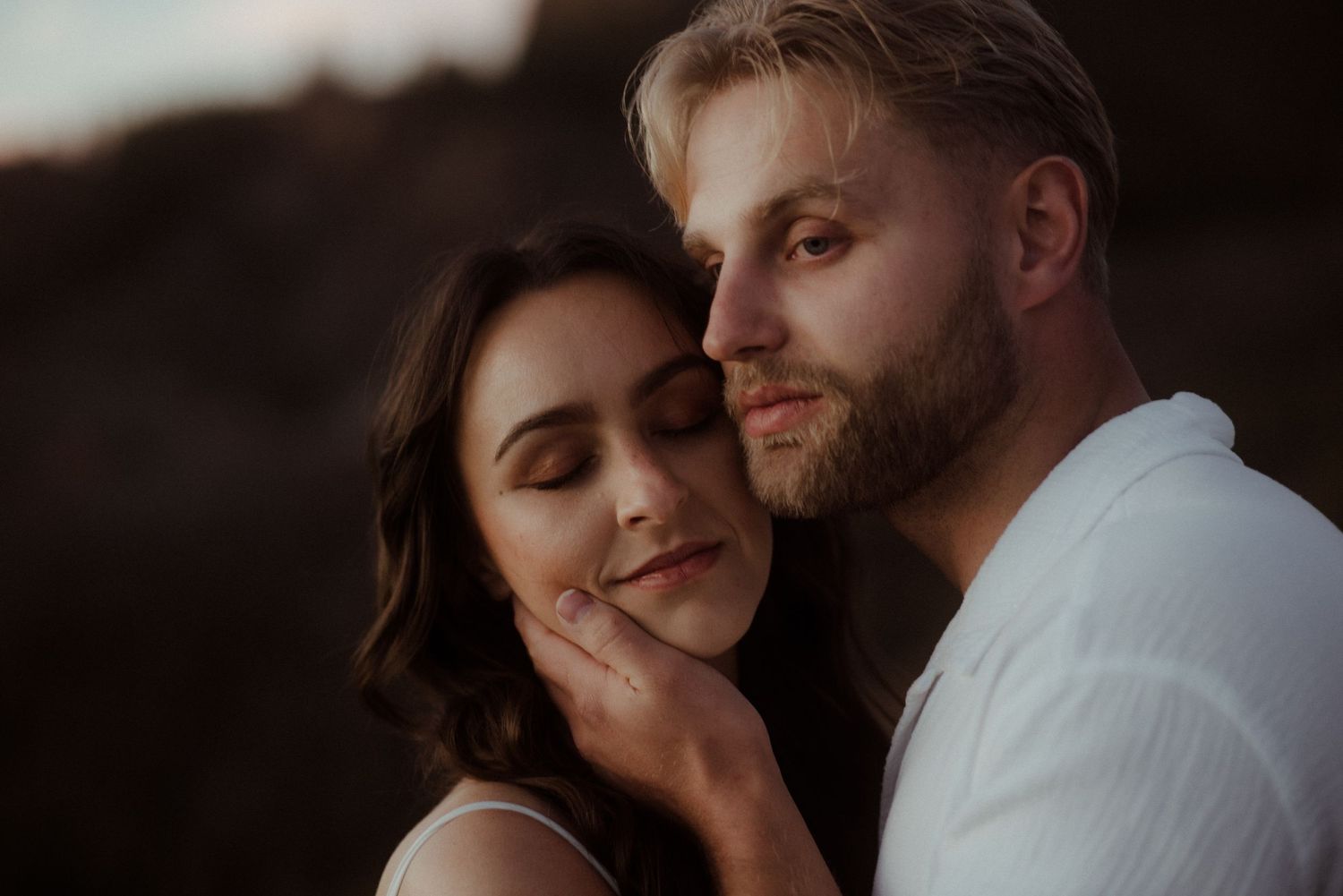 A close intimate portrait captured in warm evening light with mountain scenery. Tenerife Wedding Photographer at Teide.