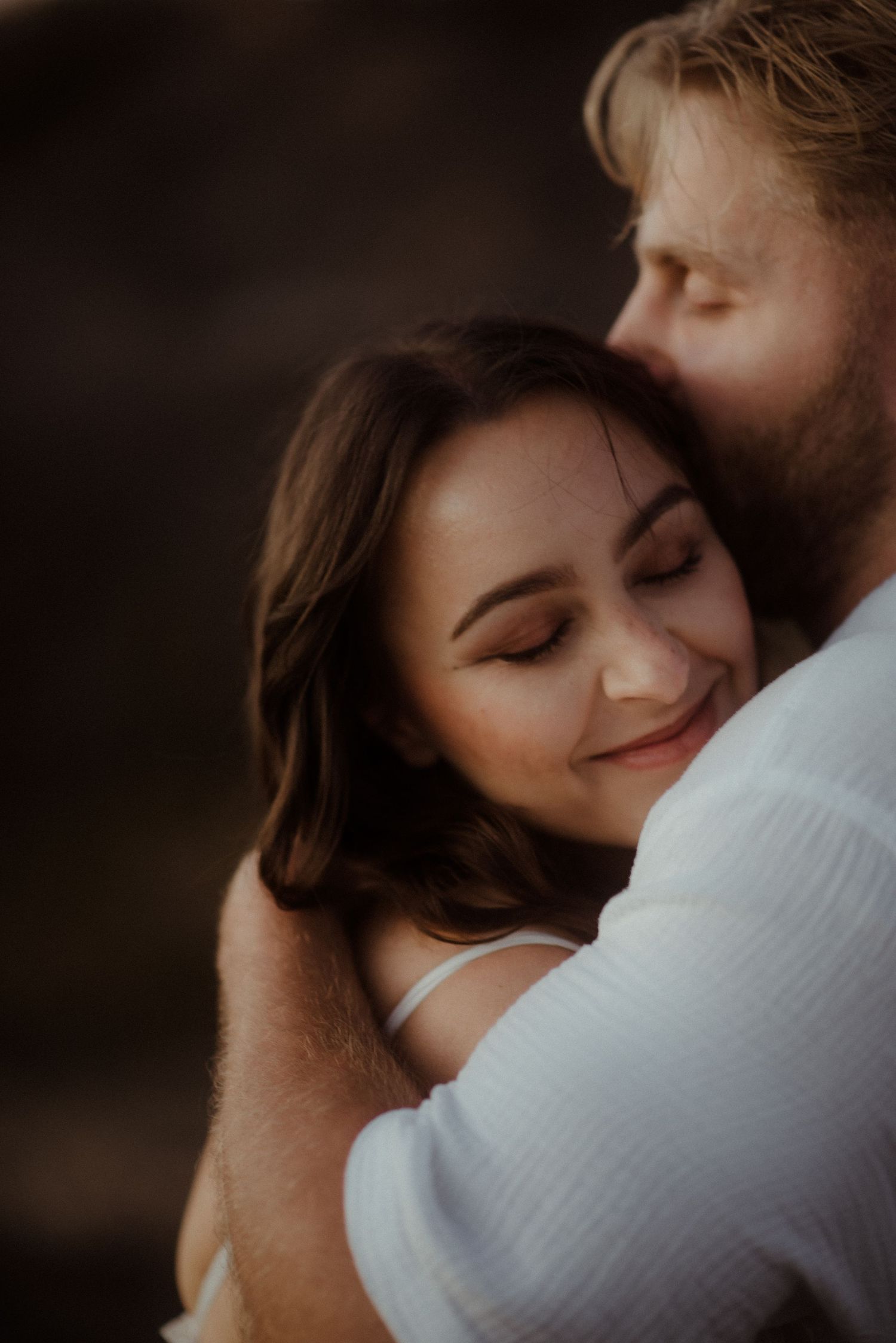 A warm, emotional embrace captured in soft golden hour lighting. Tenerife Wedding Photographer at Teide.