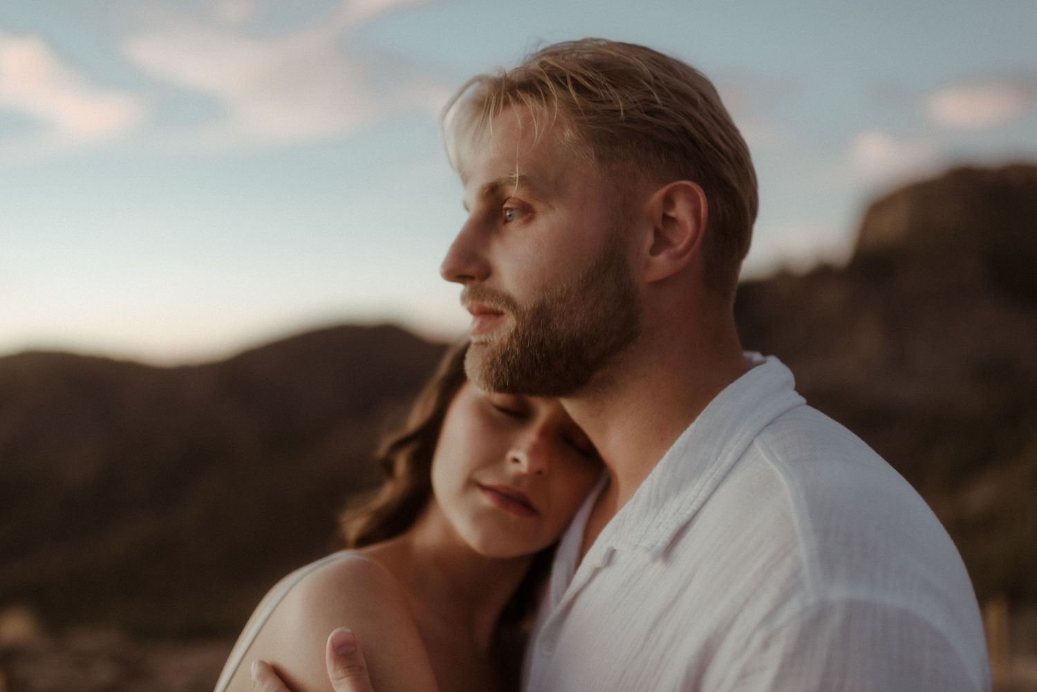 Intimate close-up portrait of couple during golden hour mountain photoshoot. Tenerife Wedding Photographer at Teide.