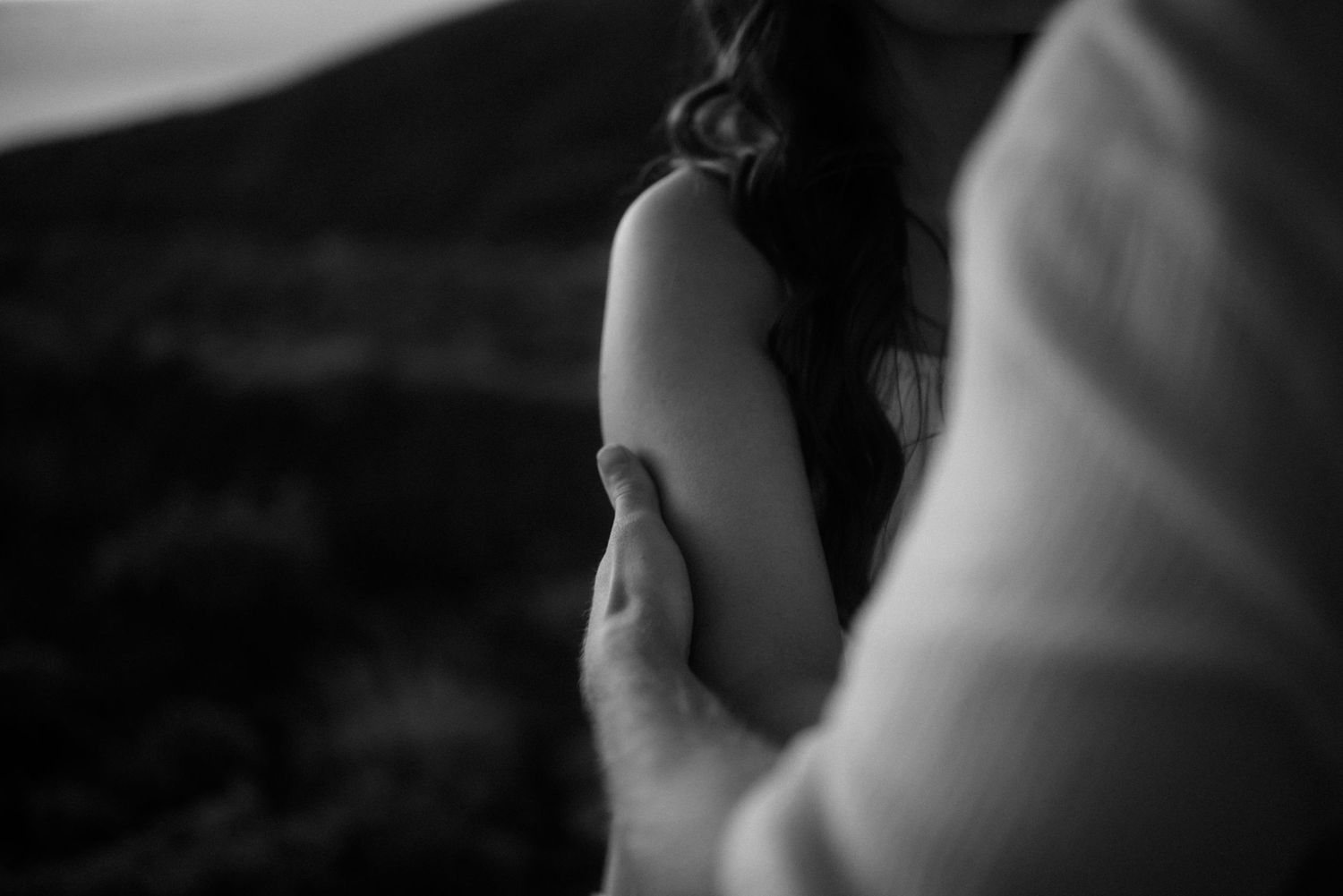 A tender black and white close-up capturing an intimate embrace. Tenerife Wedding Photographer at Teide.