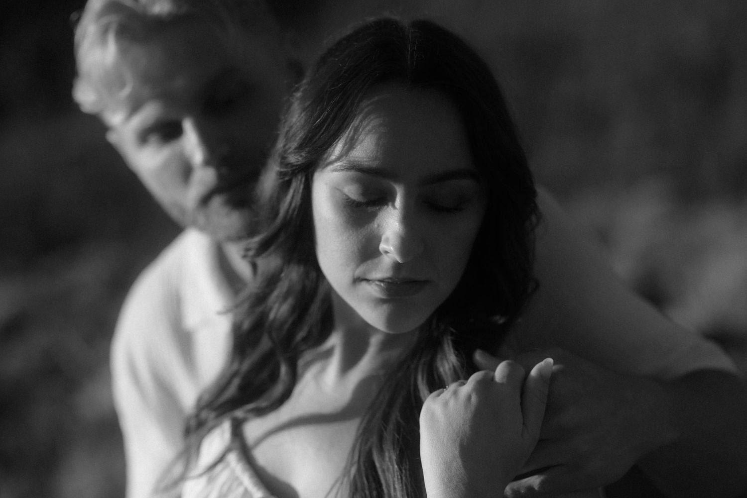 An artistic black and white portrait showing a tender moment against nature. Tenerife Wedding Photographer at Teide.