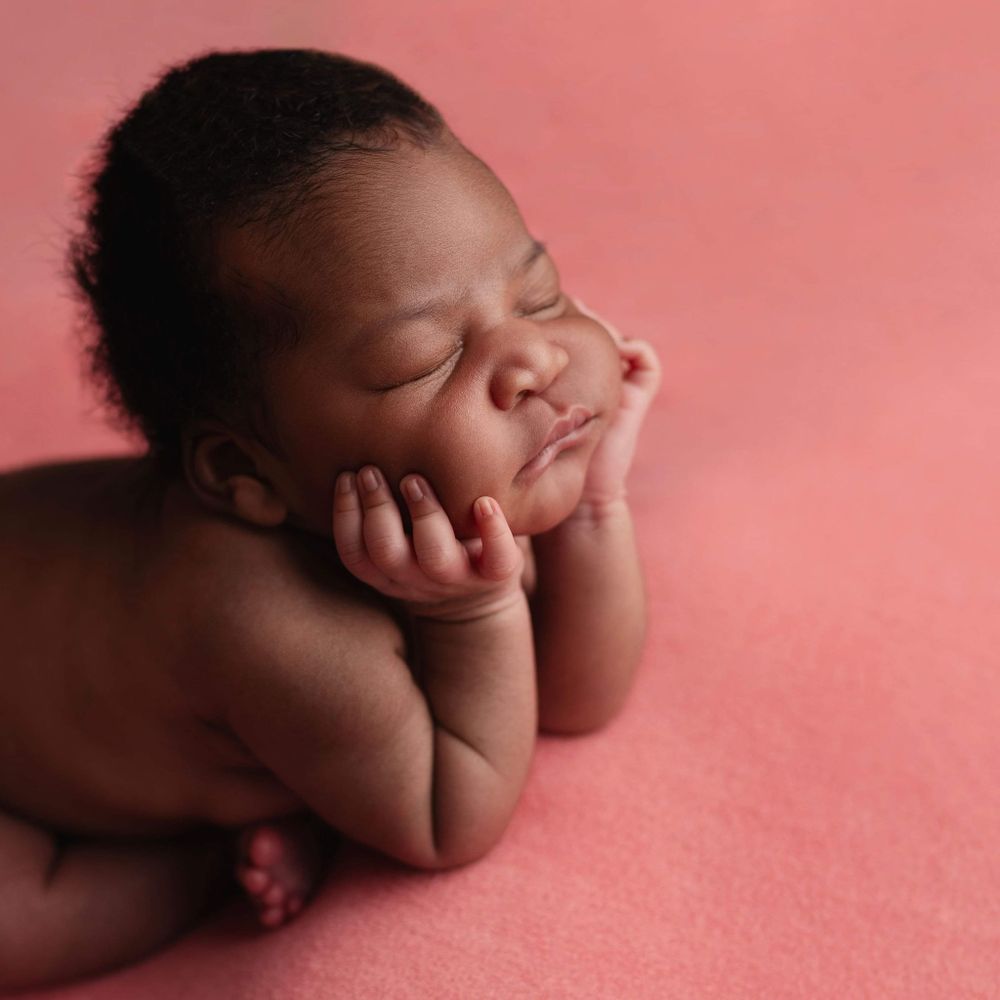 Newborn baby girl froggy pose from Elizabeth Lang Photography in Surrey.
