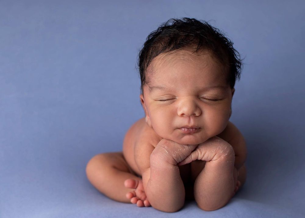 Newborn baby girl froggy pose from Elizabeth Lang Photography in Surrey.