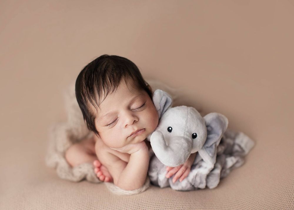 Newborn baby girl froggy pose from Elizabeth Lang Photography in Surrey.