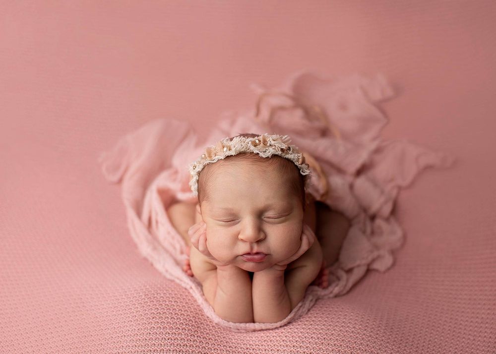 Newborn baby girl froggy pose from Elizabeth Lang Photography in Surrey.