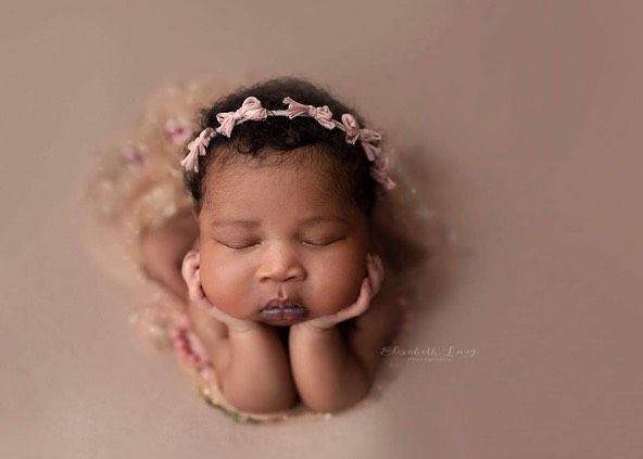 Newborn baby girl froggy pose from Elizabeth Lang Photography in Surrey.