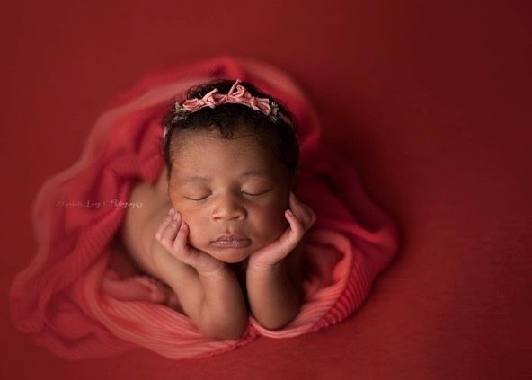 Newborn baby girl froggy pose from Elizabeth Lang Photography in Surrey.