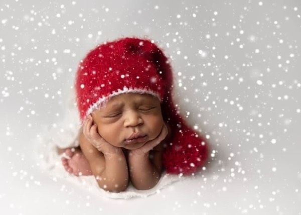 Newborn baby girl froggy pose from Elizabeth Lang Photography in Surrey.