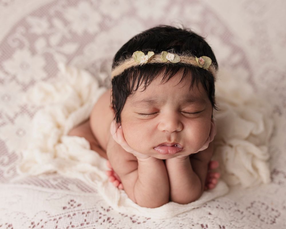 Newborn baby girl froggy pose from Elizabeth Lang Photography in Surrey.
