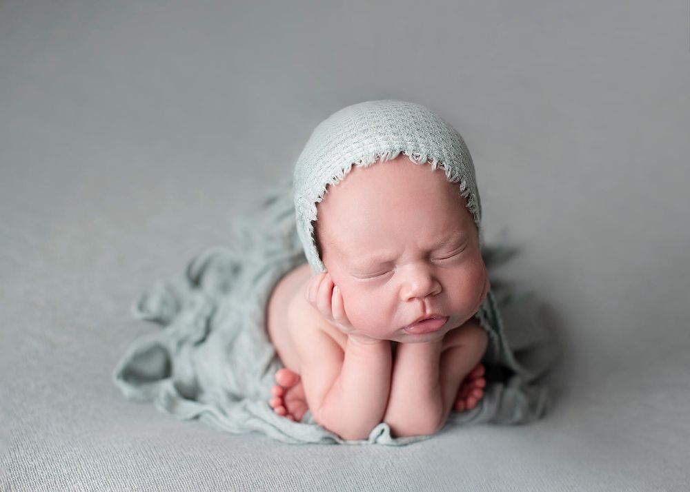 Newborn baby girl froggy pose from Elizabeth Lang Photography in Surrey.