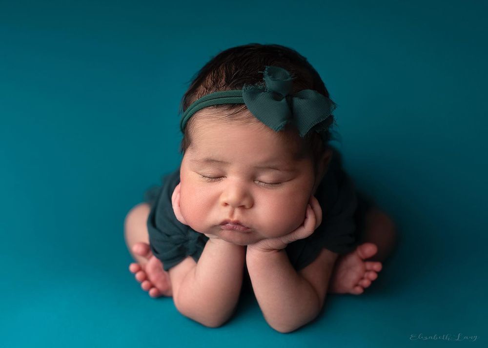 Newborn baby girl froggy pose from Elizabeth Lang Photography in Surrey.