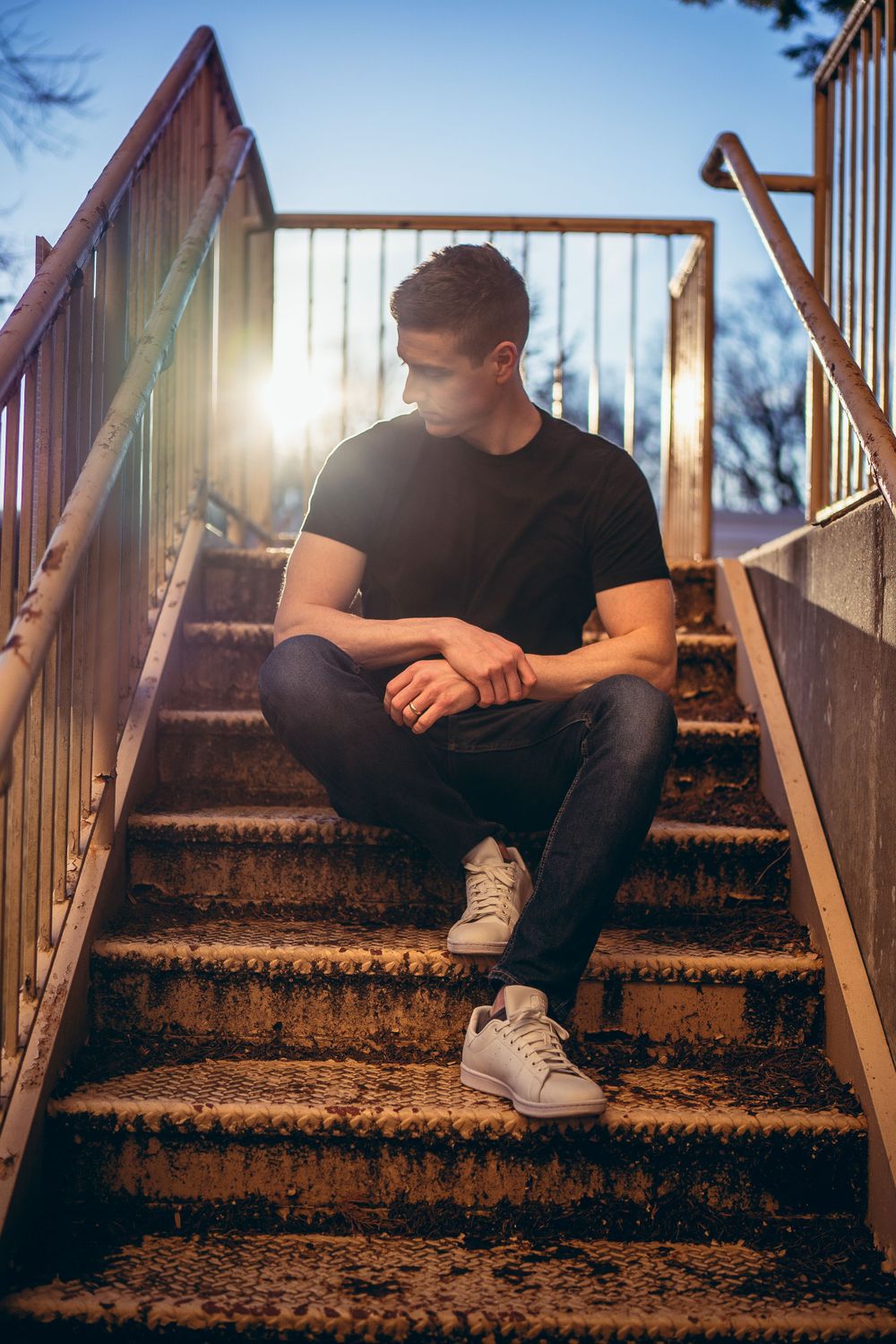 Portrait of musician Kinger in Rockville, MD in an urban, textured, grunge setting.
