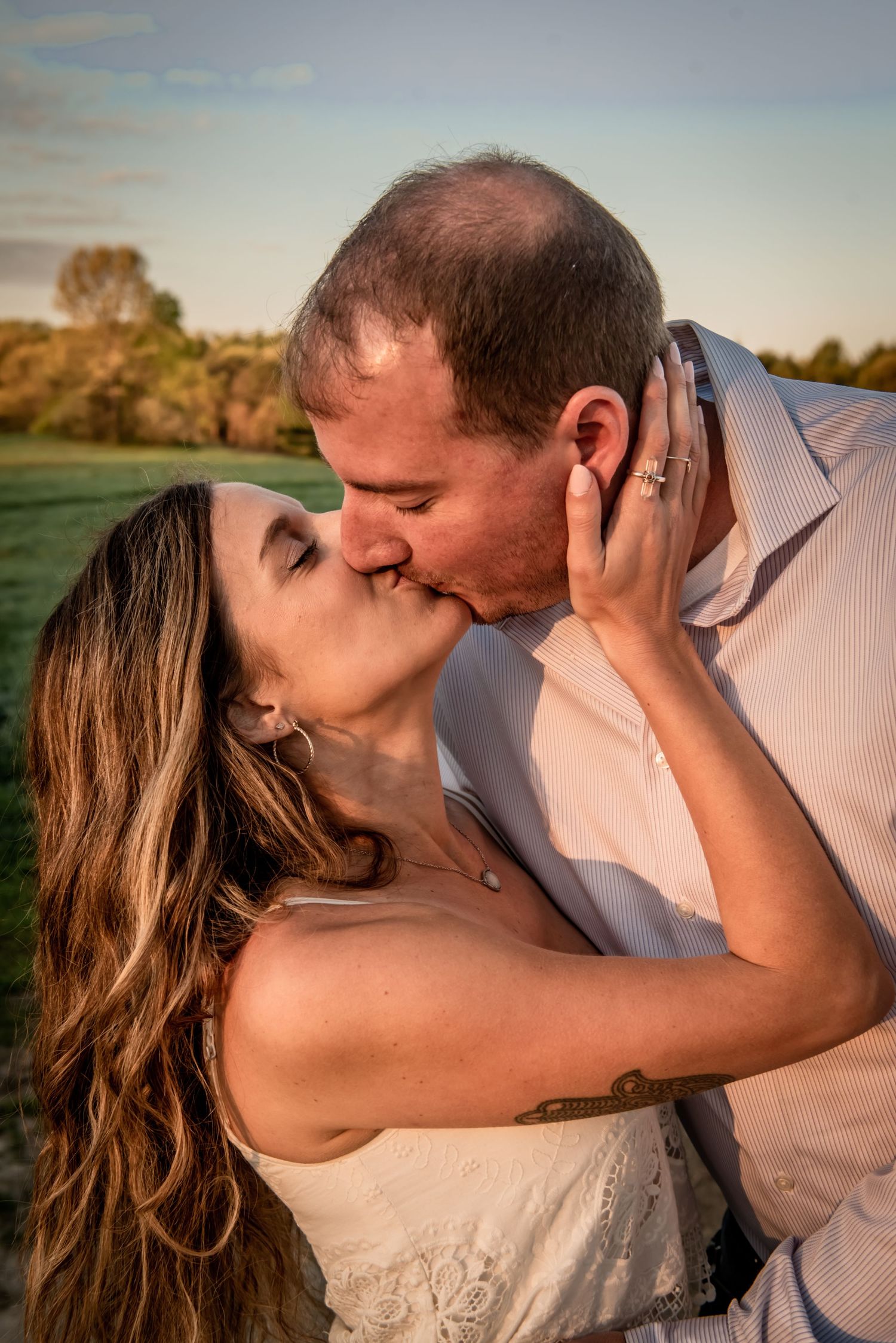 Romantic sunset kiss during outdoor photo session. Massachusetts Engagement Photographer- Affordable