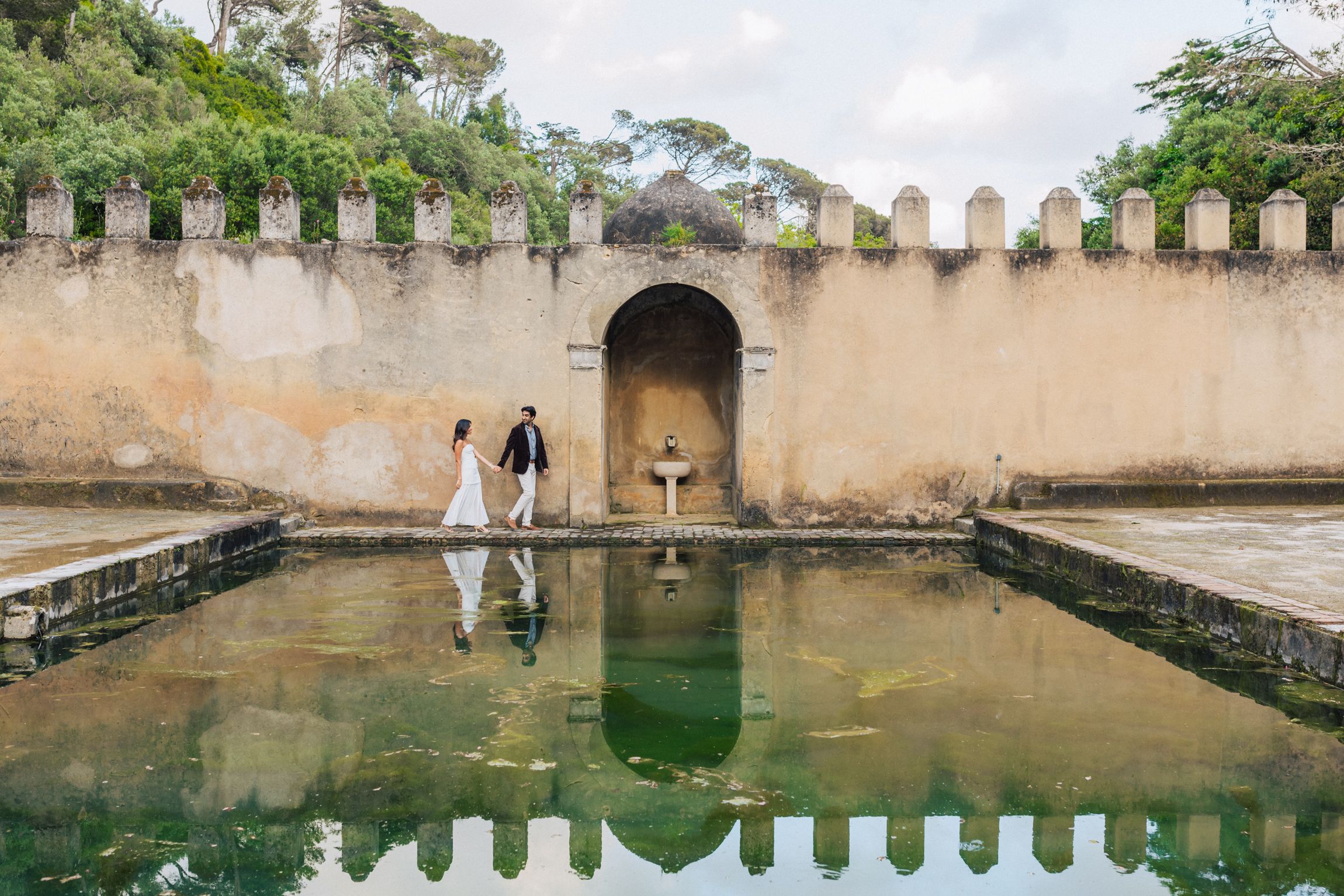 Romantic engagement photo-shoot in Sintra, Portugal, with an Indian couple exploring Penha Longa. By a destination wedding Photographer