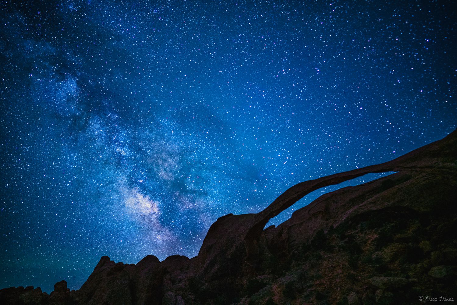 Milky way over landscape arch red rocks in Utah