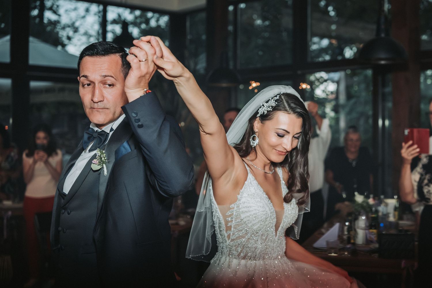 Newlyweds dancing together during their reception celebration.