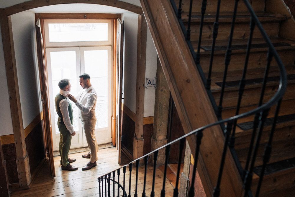 gay wedding couple getting ready together to celebrate their destination wedding in Portugal. by Lisbon wedding photographer