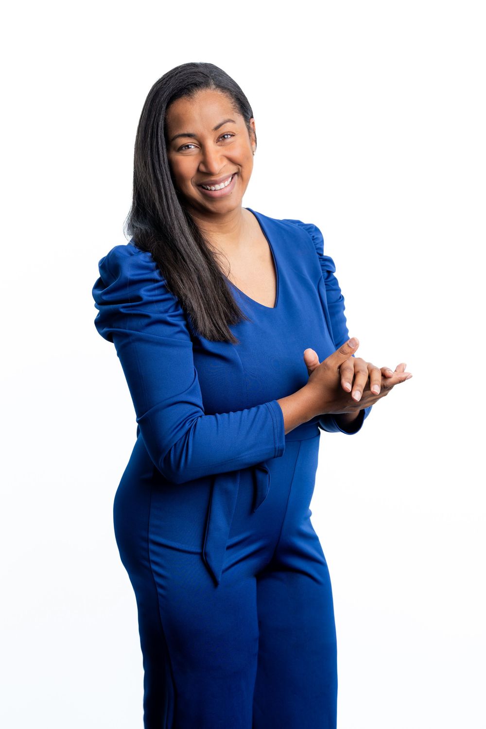 Branding photo and clean head shot for a virtual assistant. Woman standing in a blue suit ready to help!