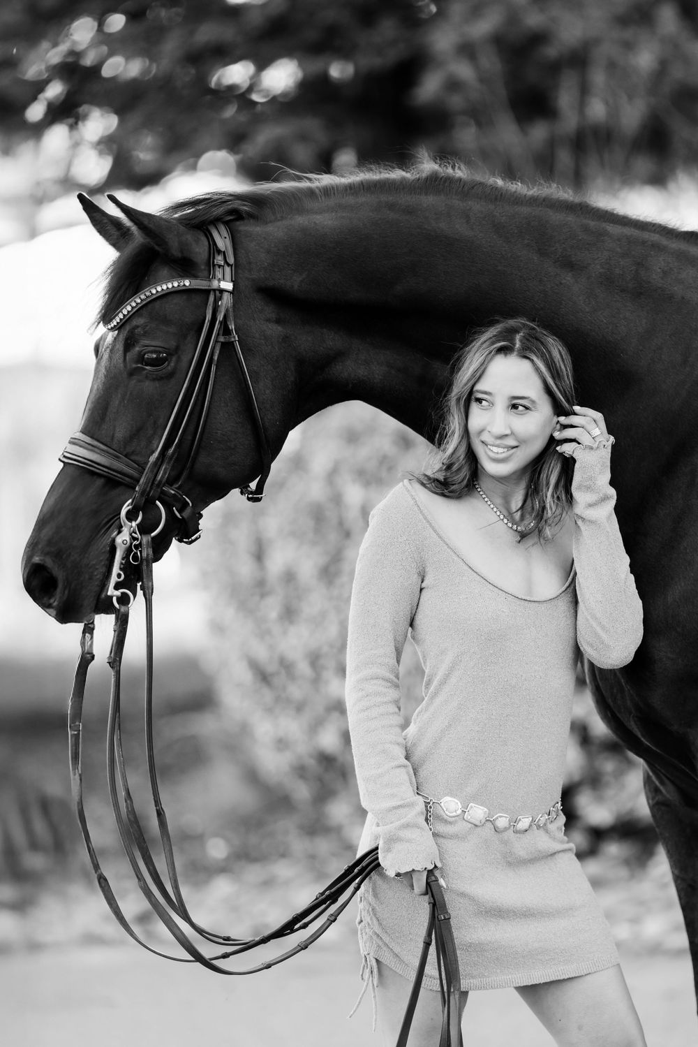 Black and white equestrian portrait featuring a horse with traditional English riding tack.