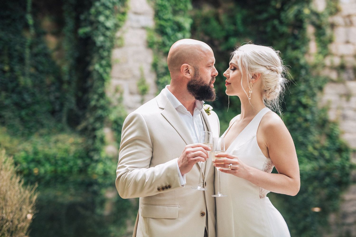 Bride & groom at Casa dos Penedos, a wedding venue from Penha Longa Catering. A romantic moment captured by a Portugal wedding photographer.