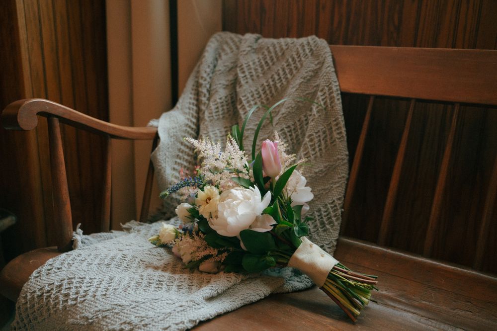 brides' flowers on bench