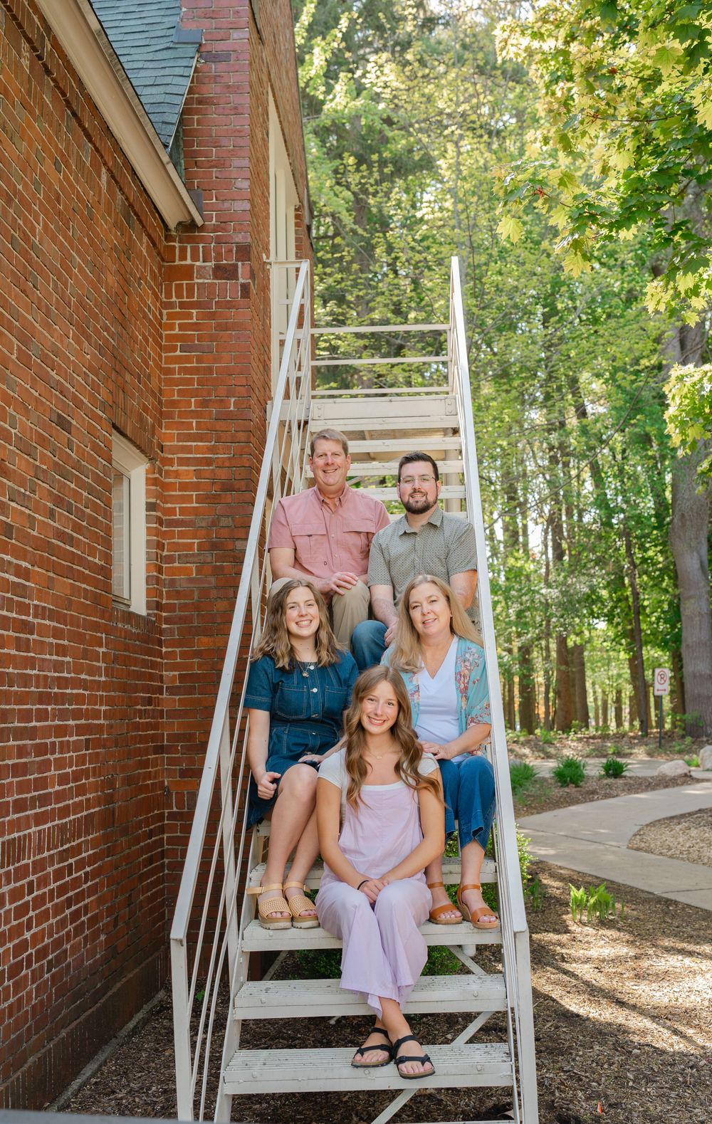 family sitting on stairs