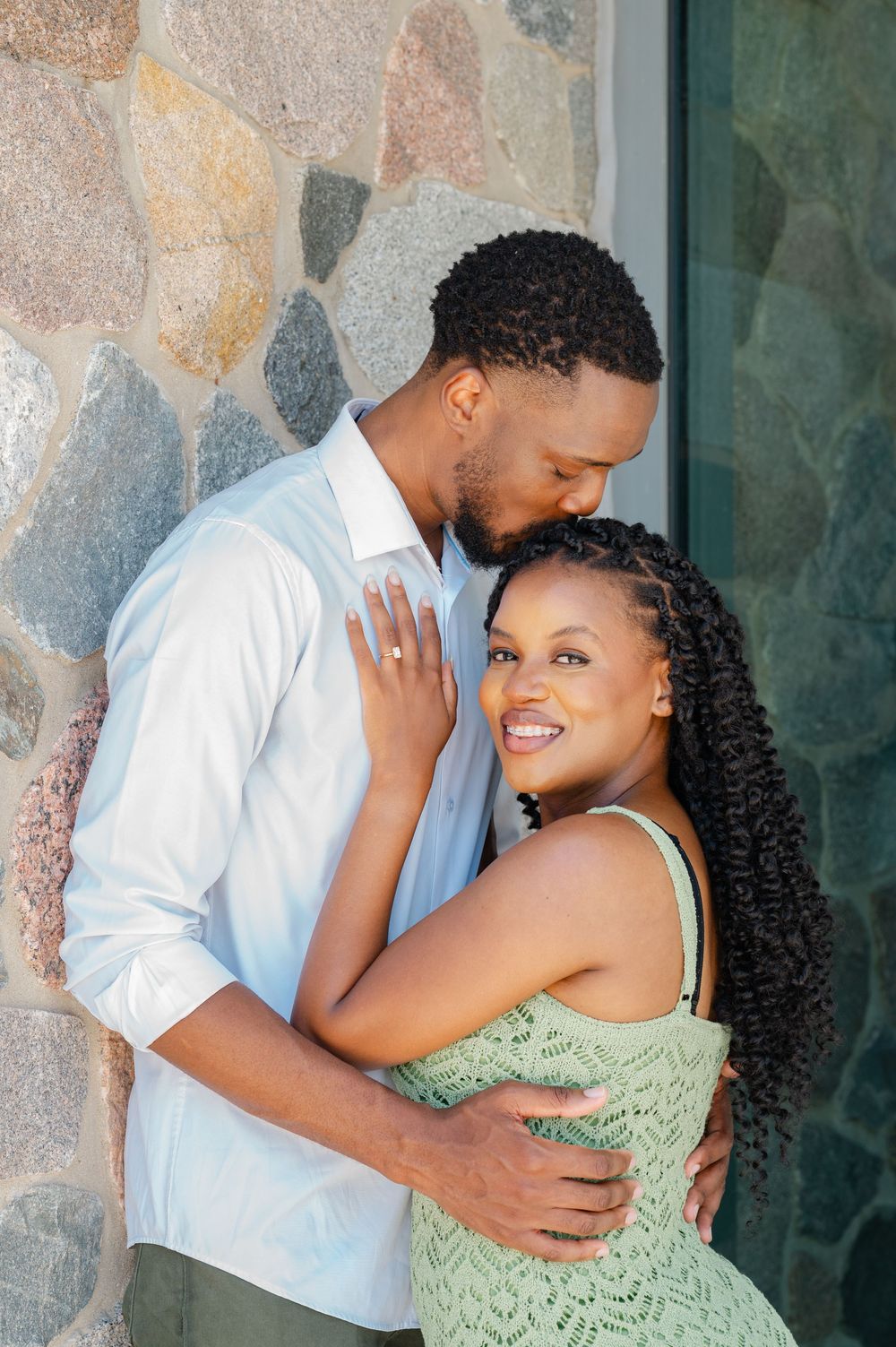 couple leaning against wall
