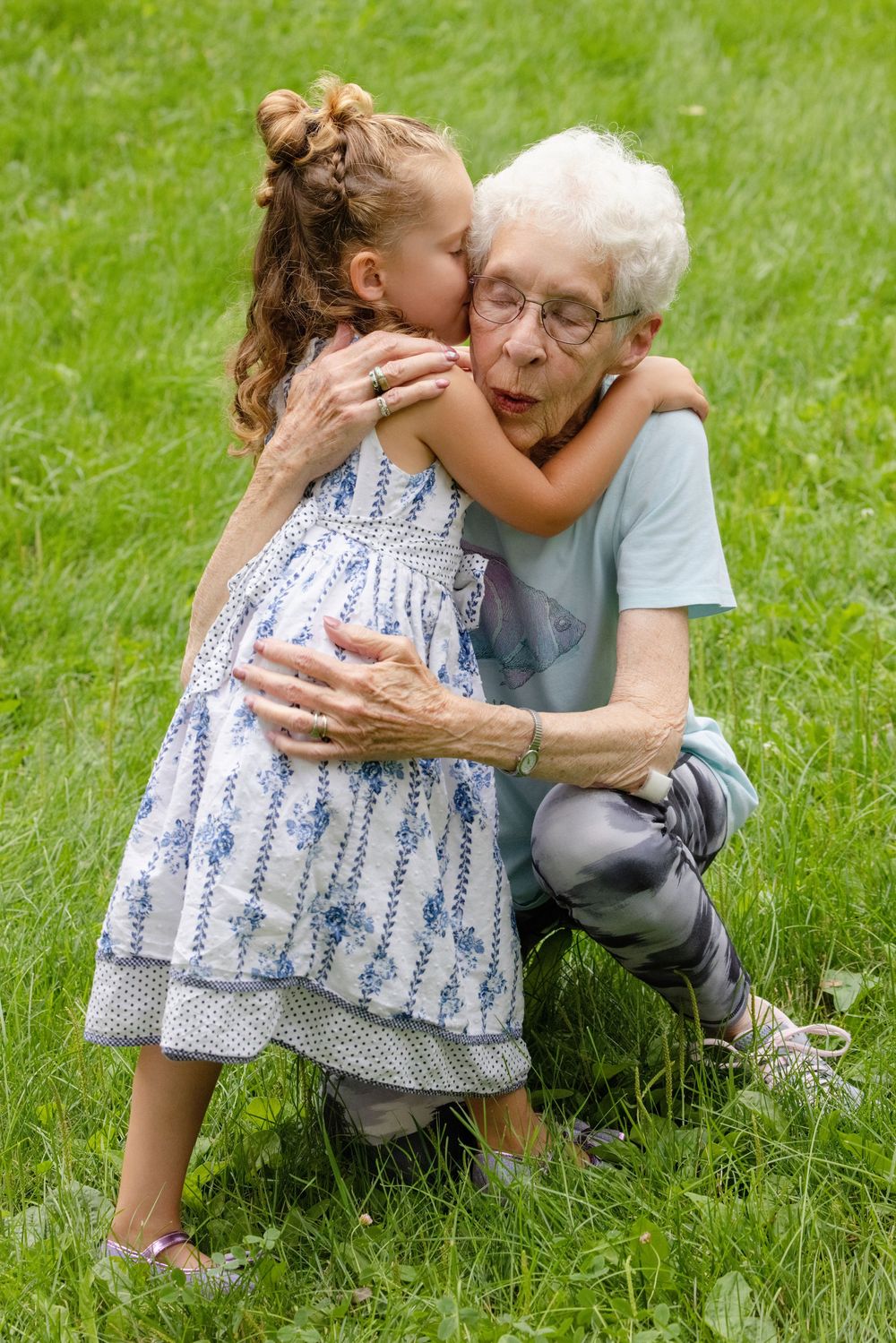 A touching outdoor embrace between generations on a sunny summer day.