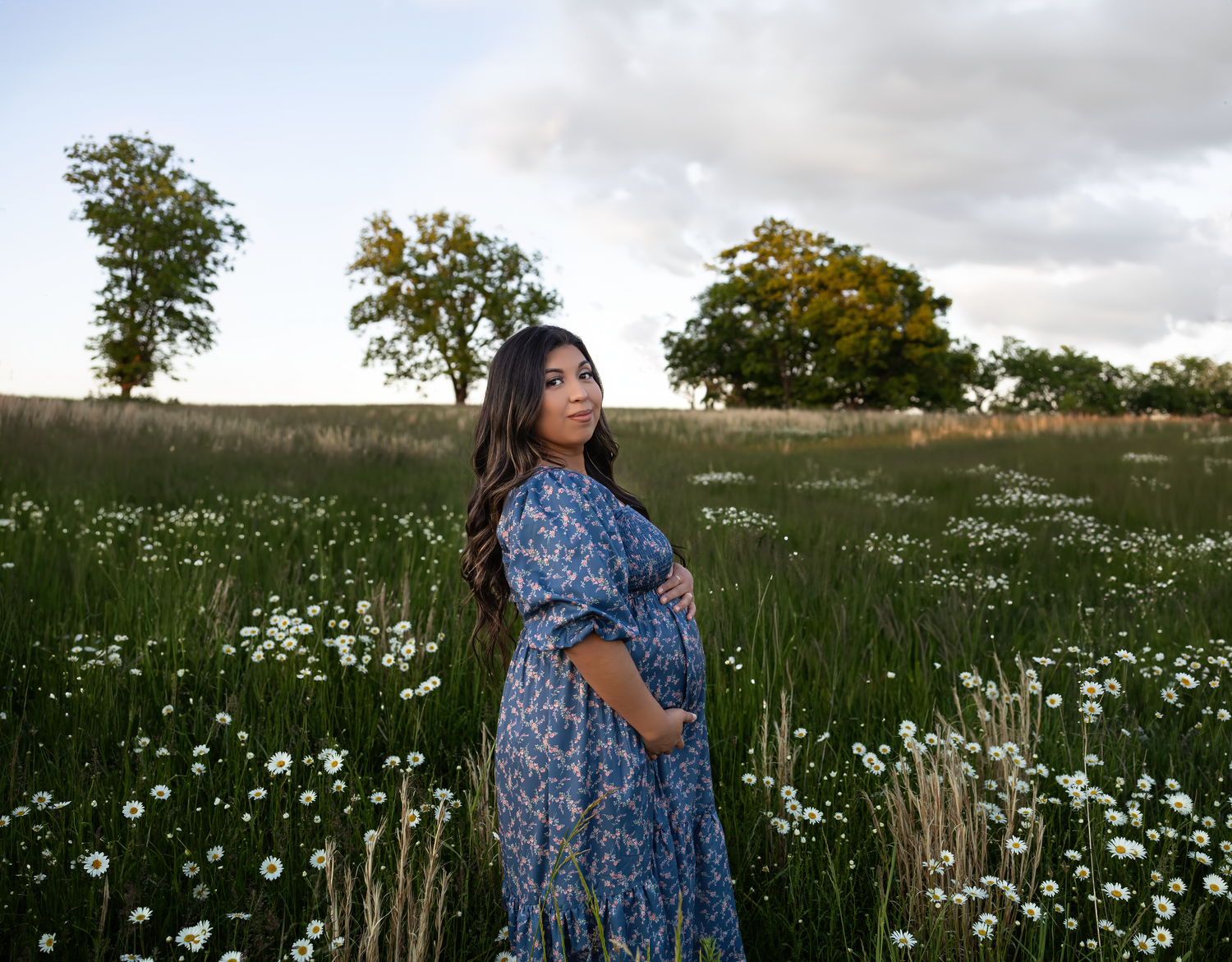 A golden hour maternity session in the Kentucky fields capturing a growing family’s love as they await their second baby boy, photographed b