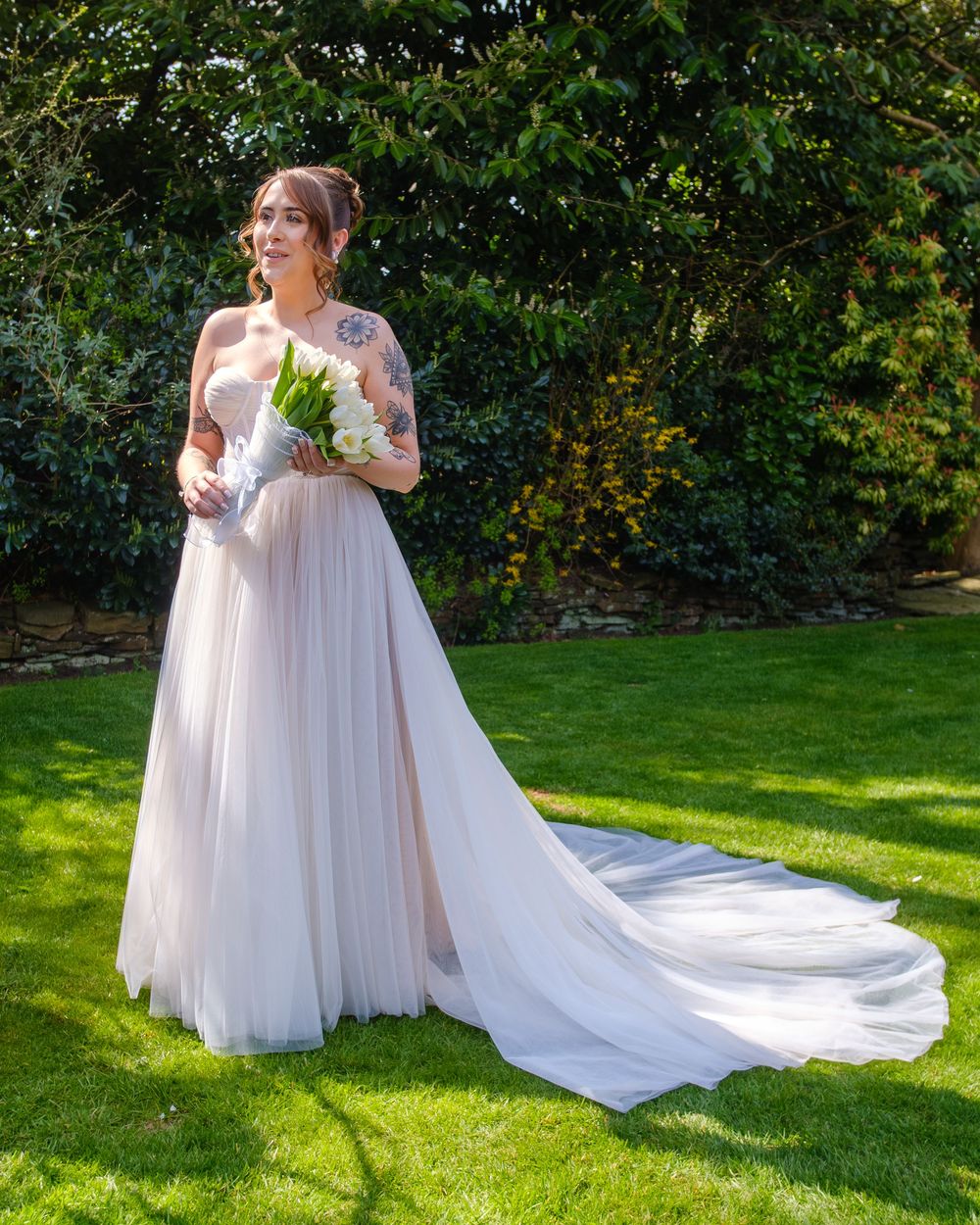 Bride looking beautiful in the golden light at Holdsworth House
