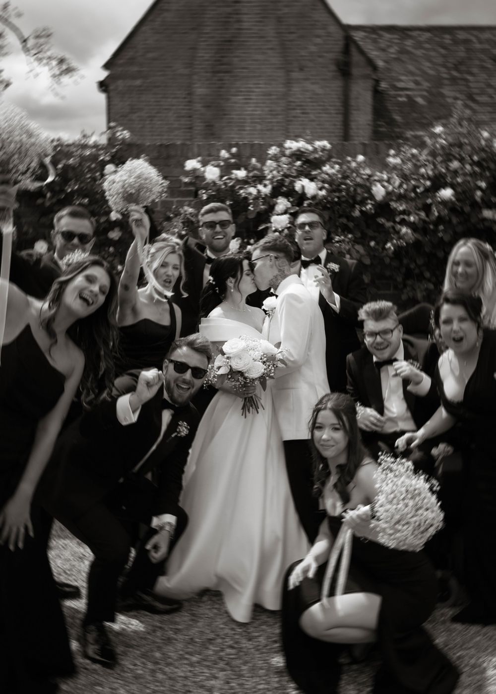 motion blur fun group photo bride and groom kiss at Primrose Hill farm Wedding- Photo by Primrose Hill Farm Wedding Photographer