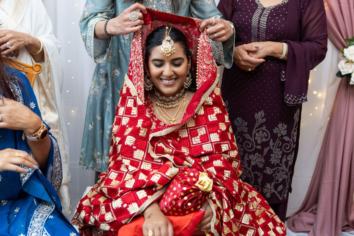 A collection of candid moments from a traditional Indian wedding celebration showing festive red and gold attire.