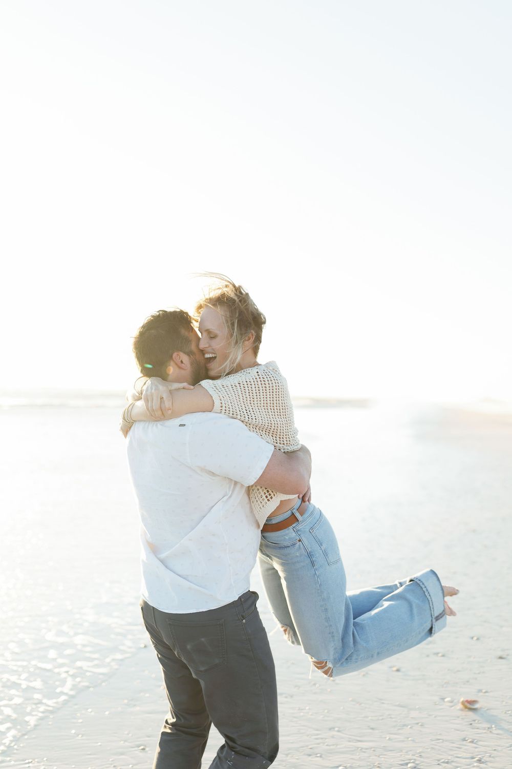Quiet kiss with soft natural light on Siesta Key beach