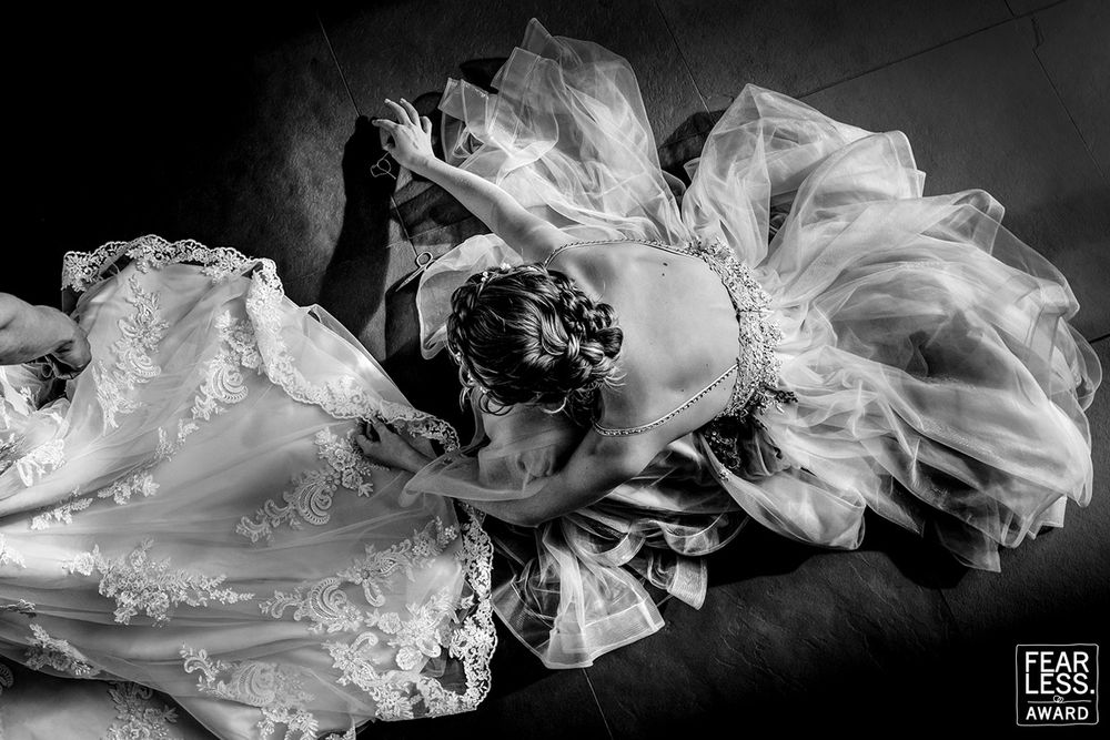 Artistic black and white photographs of flowing sheer fabric moving through air creating ethereal dynamic shapes.