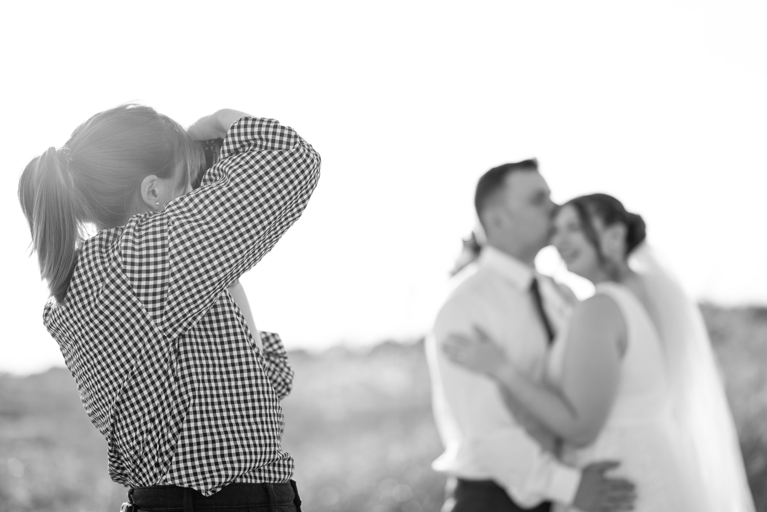 Emily Barrett capturing candid moments during a Florida wedding ceremony.
