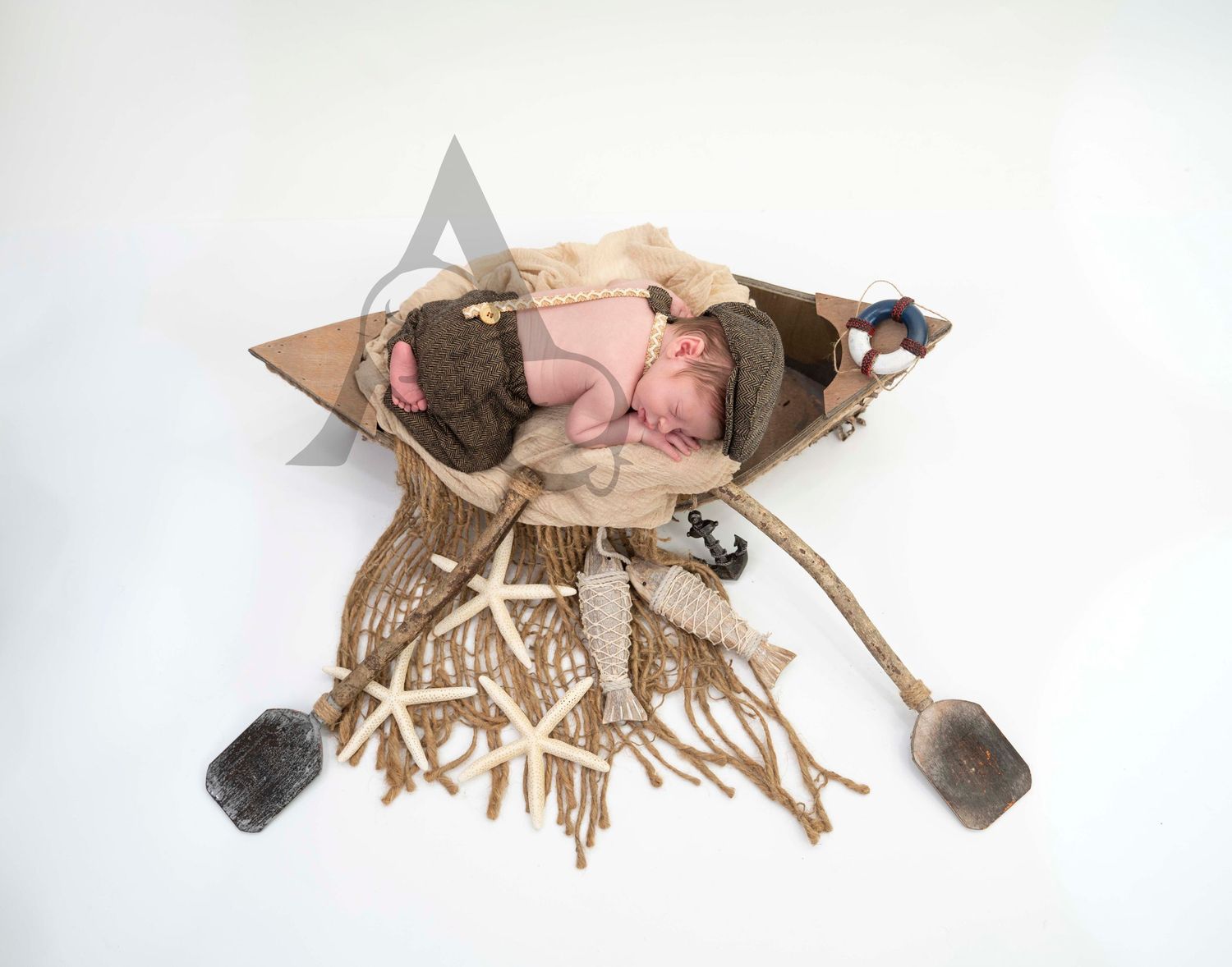 Newborn Baby Posing in Boat on White background