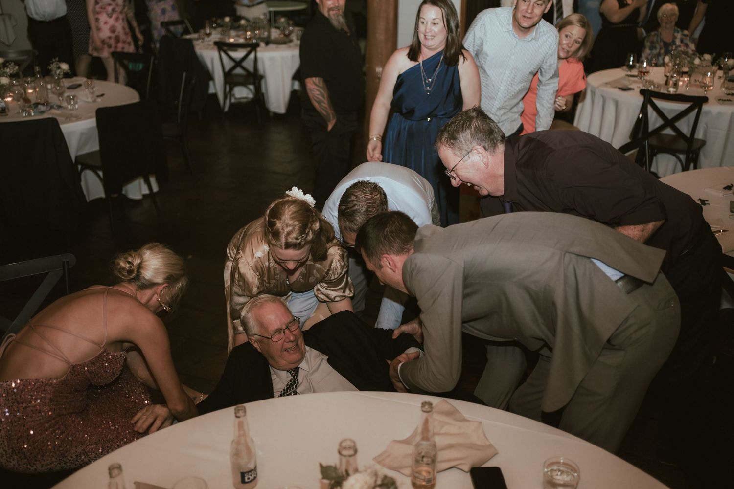 Wedding guests playing games during reception celebration.
