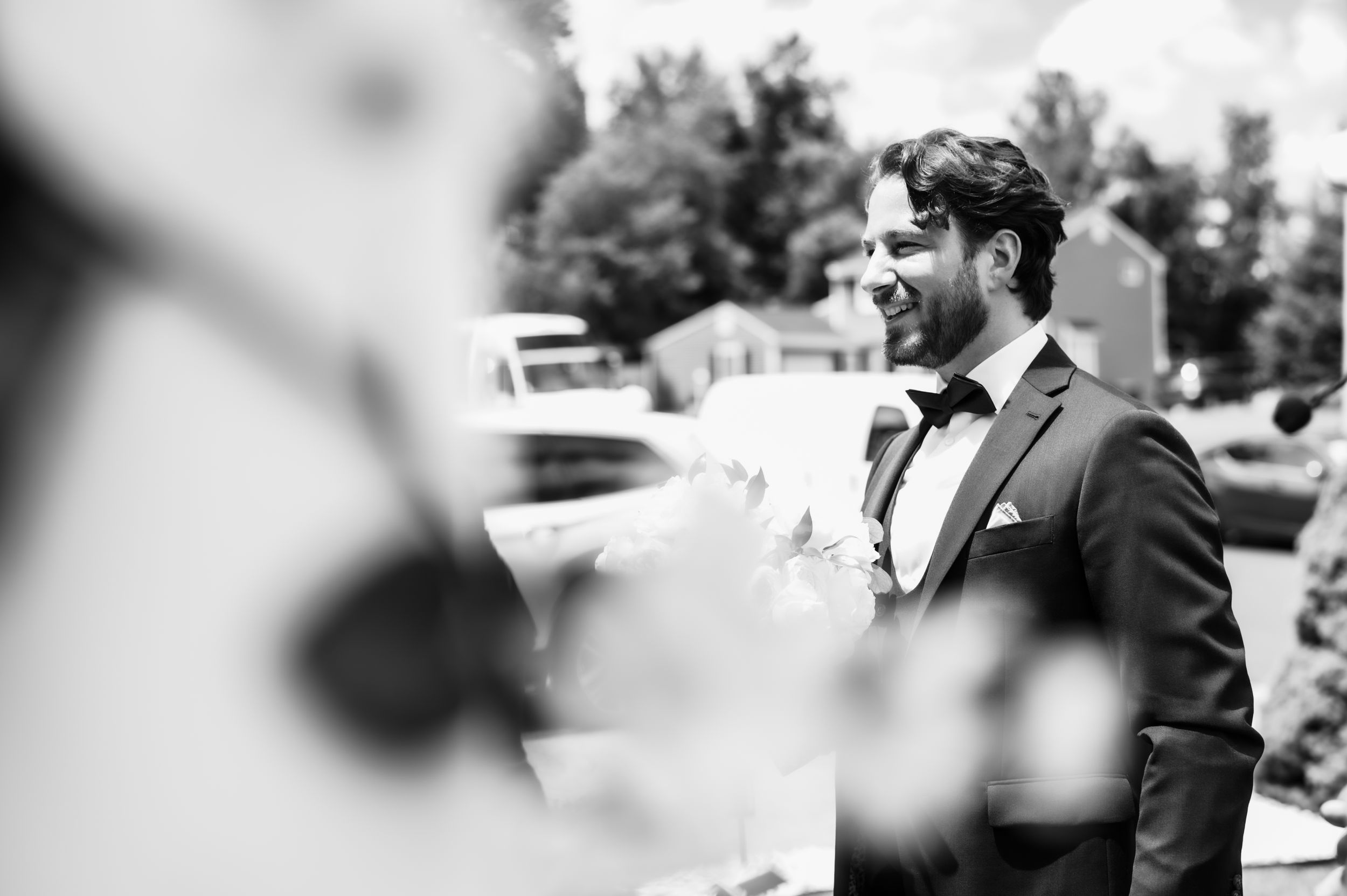 Black and white candid moment during wedding day.