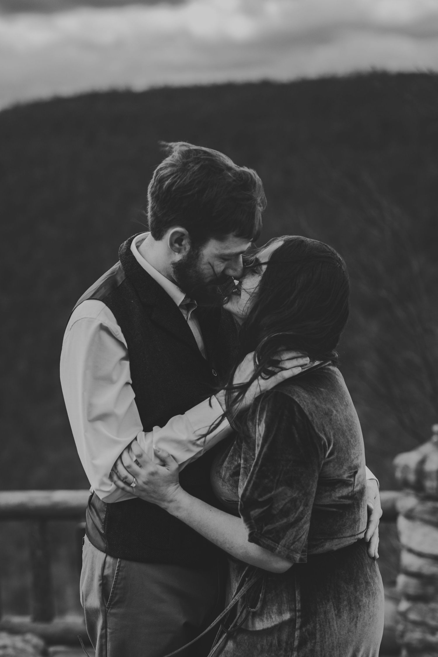 WV engaged couple embrace at Coopers Rock State Park