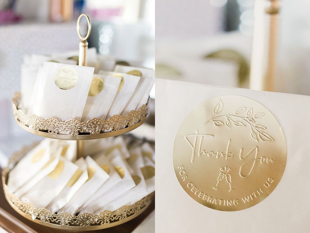 Wedding favor display featuring elegant gold-sealed thank you notes and decorative packaging.