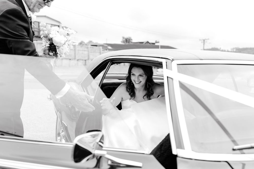 Classic car preparing for a wedding departure.
