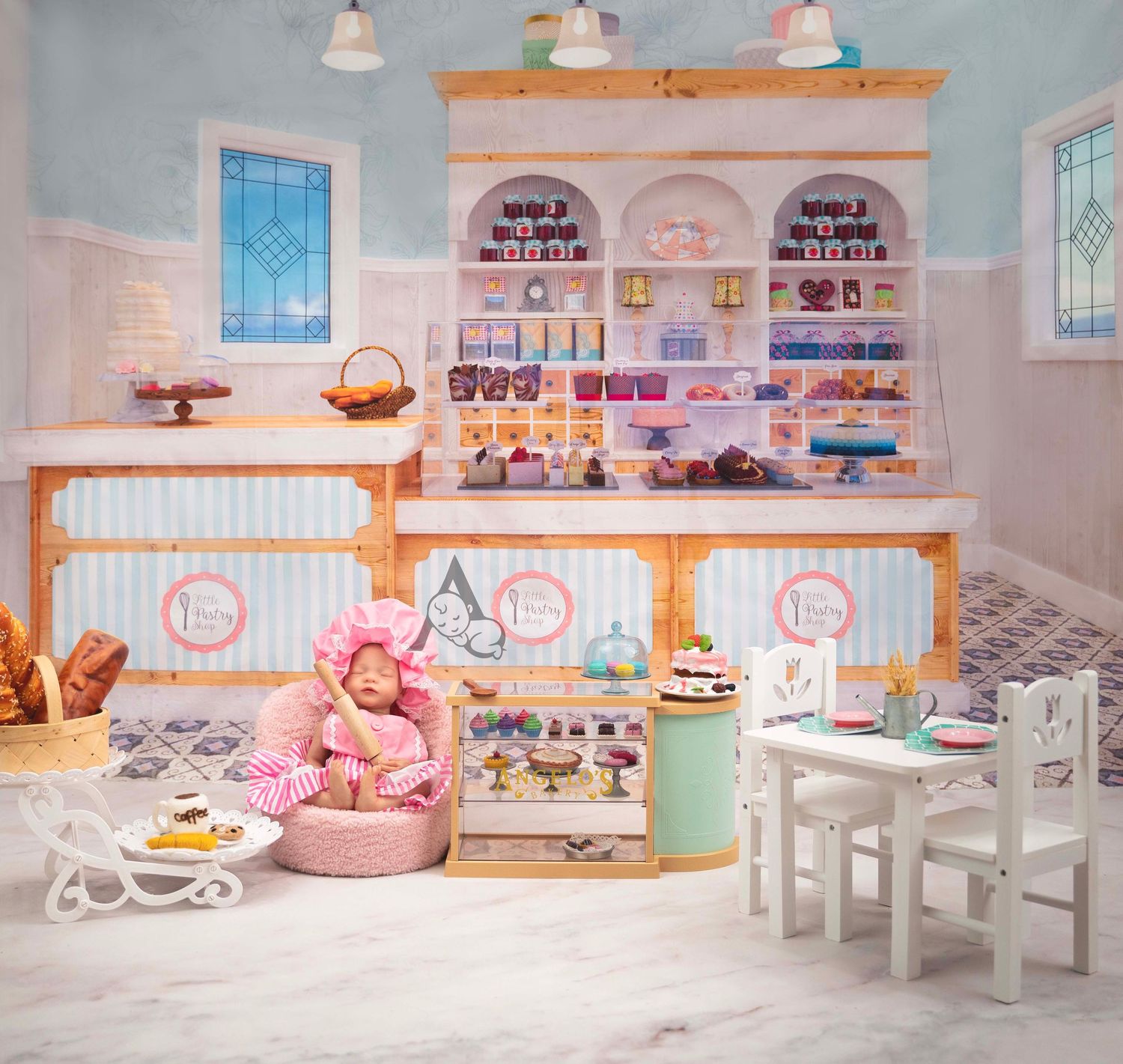 Whimsical pink and white bakery interior with display cases, stained glass windows, and cozy seating area.