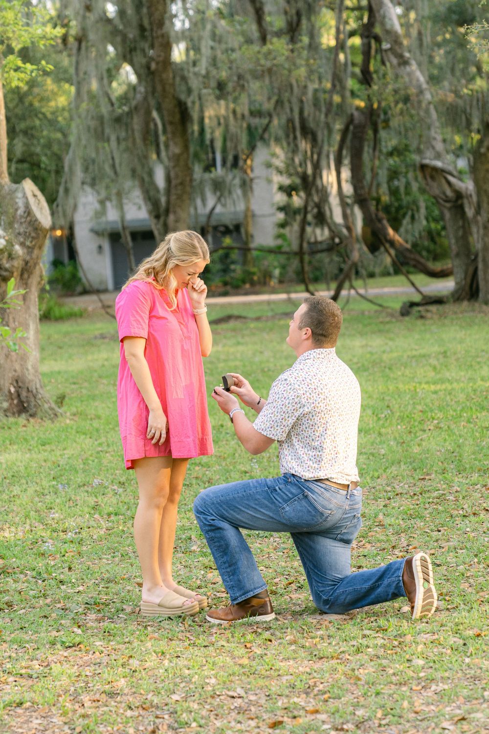 Surprise proposal at Mallery Park in St. Simons—live oaks, golden light, and pure joy captured in the Golden Isles.