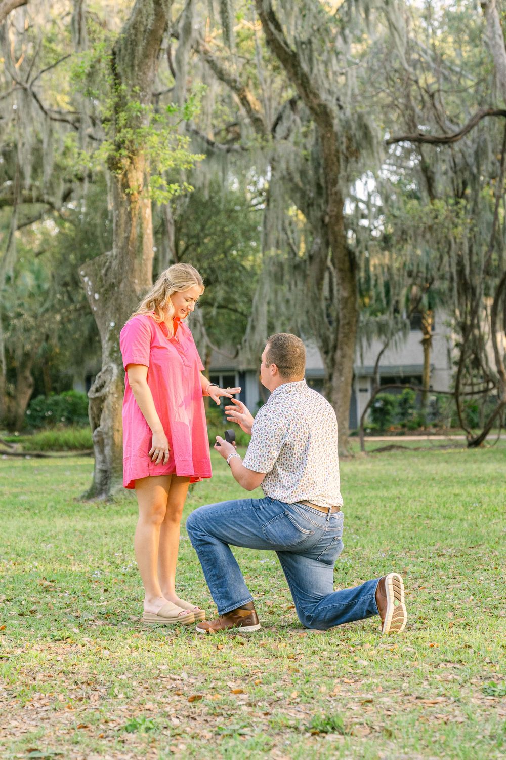 St. Simons Island proposal at Mallery Park—timeless moments captured beneath Spanish moss and southern skies.