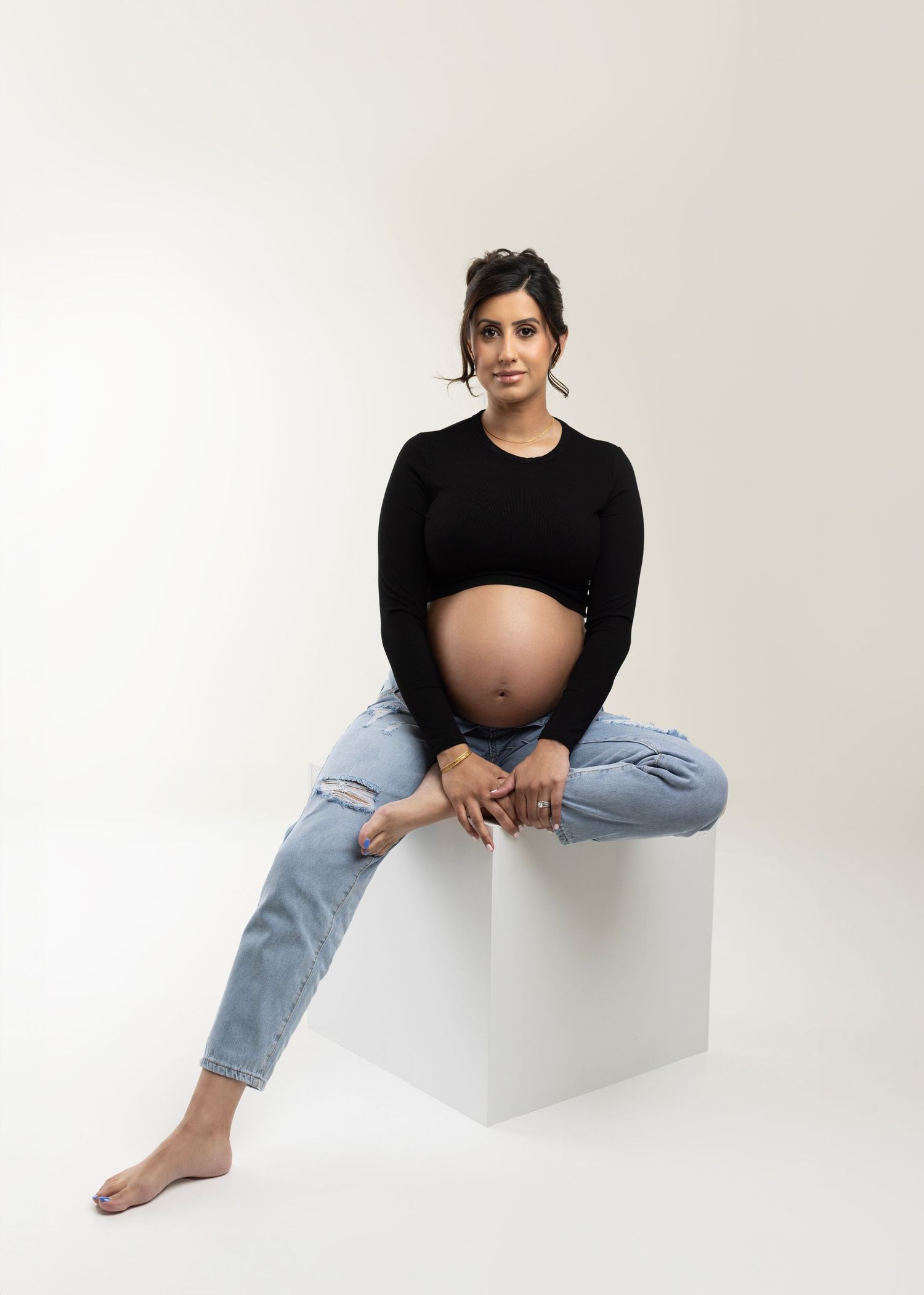 Gorgeous Rumneet awaits her new baby's arrival. Cloverdale. Surrey. Maternity Photography bump photos. Sleek black dress with cutout.