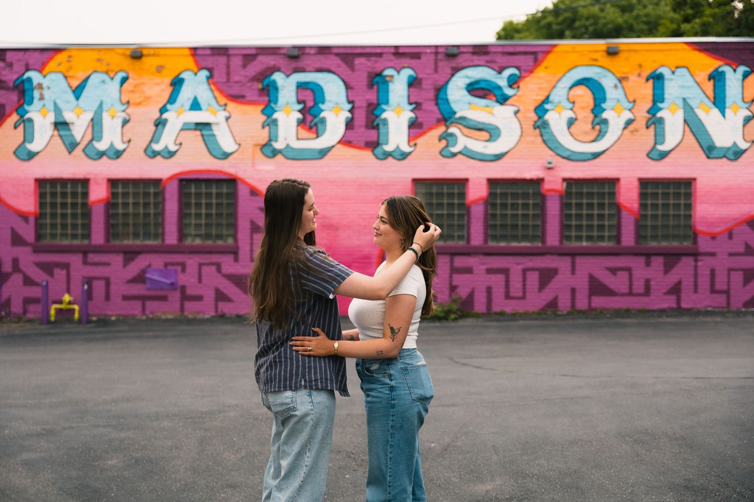 madison wi couples engagement photographer monroe street mural triangulador lauer realty group lgbtq colorful unique photos wisconsin urban